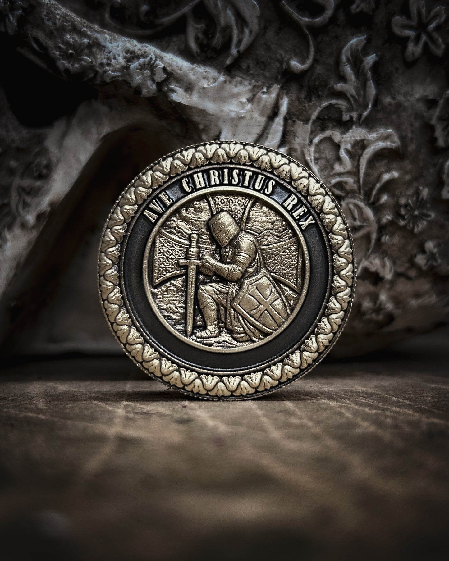 Decorative coin with intricate crusader   design on a textured surface