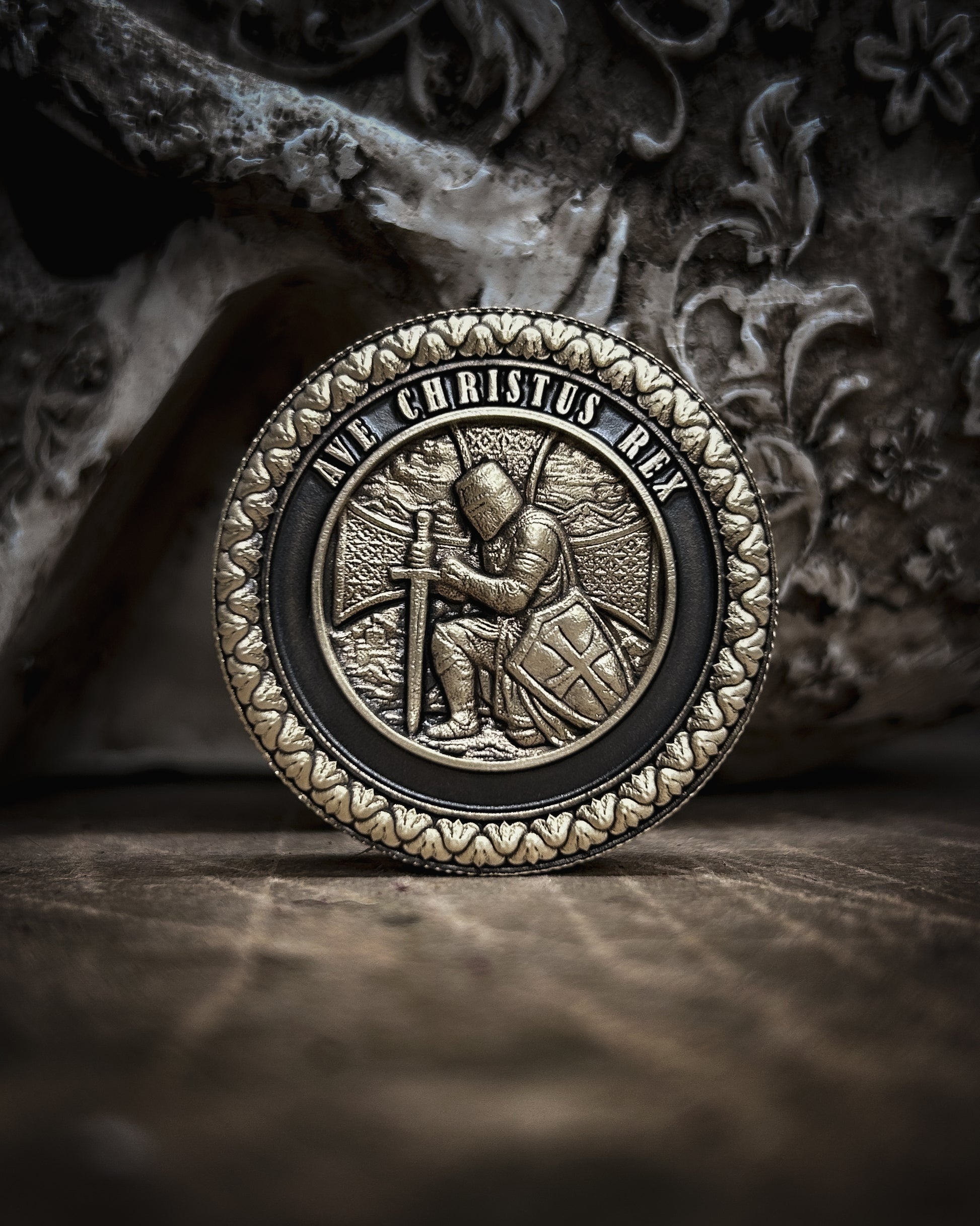 Decorative coin with intricate crusader   design on a textured surface