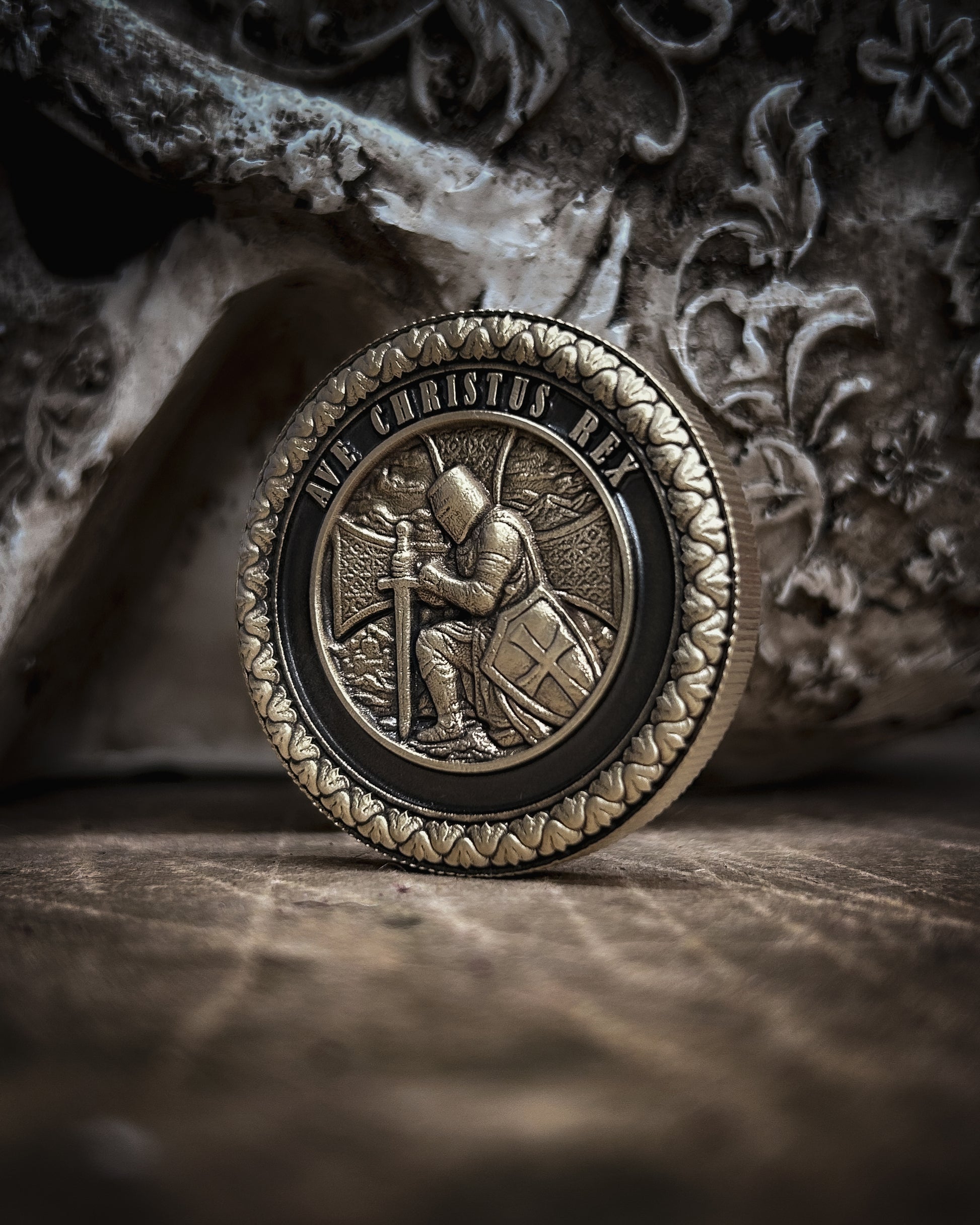 Decorative coin with intricate design on a textured surface