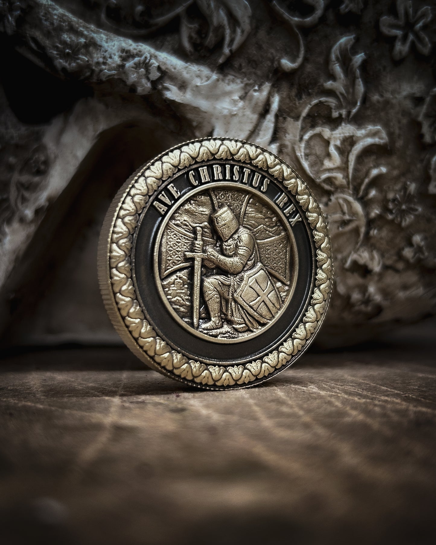 Decorative coin with intricate design on a textured surface