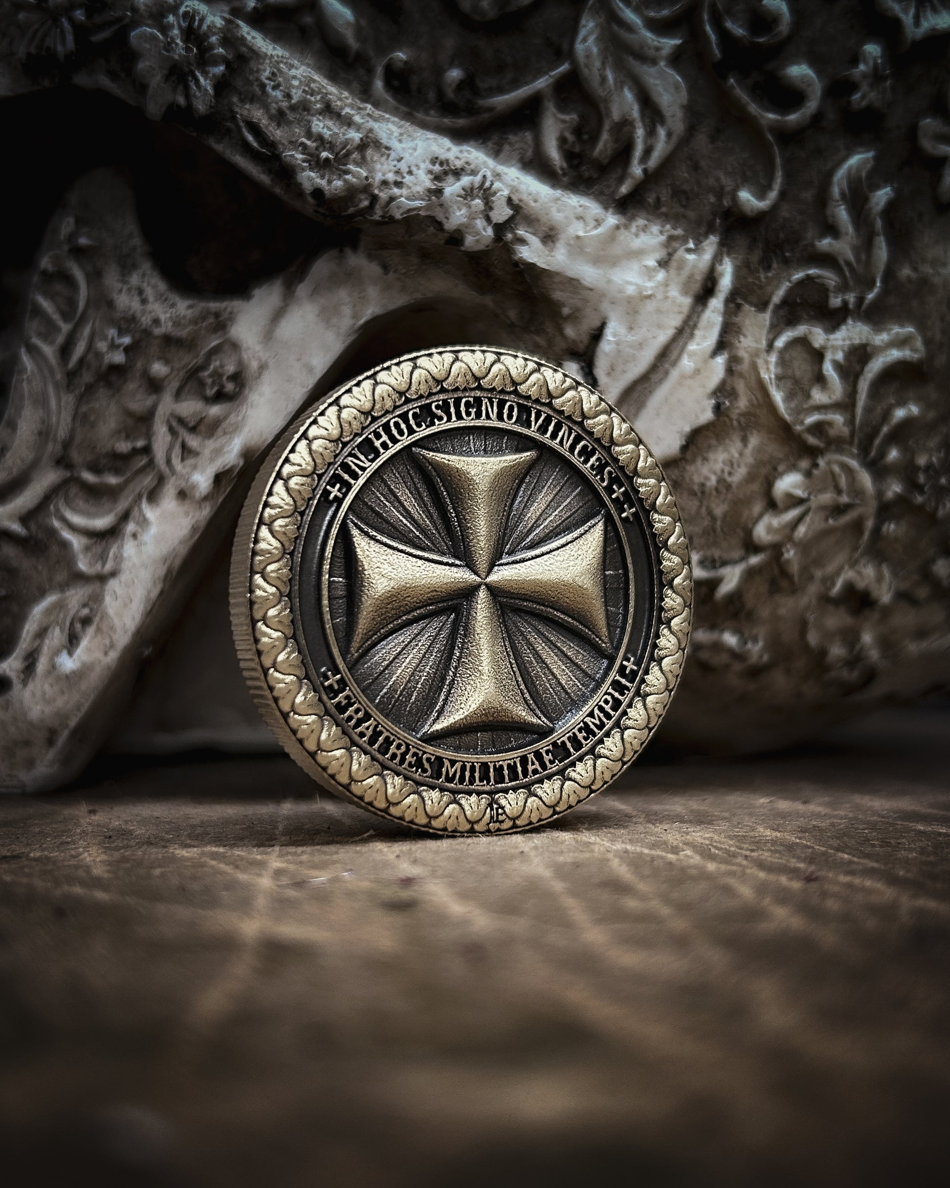 Decorative coin with intricate design on a textured surface